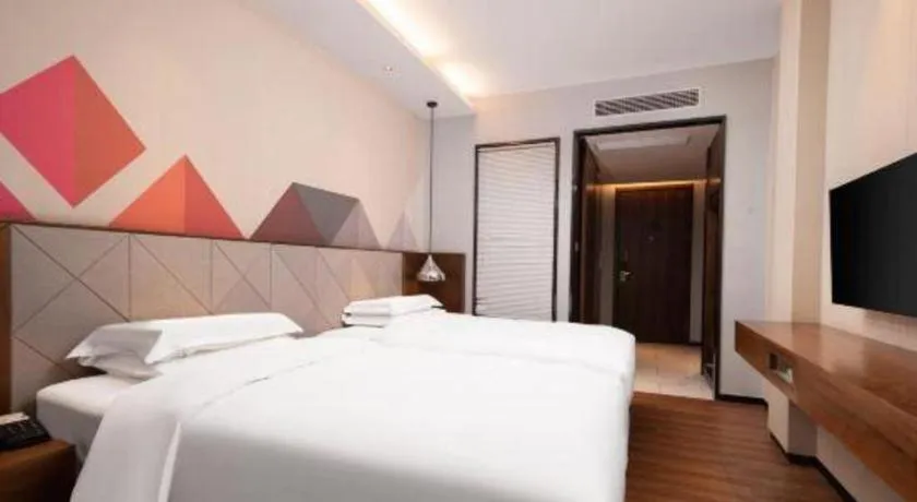 Bed in Borrman Hotel Qianjiang High-speed Railway Station Lobster City