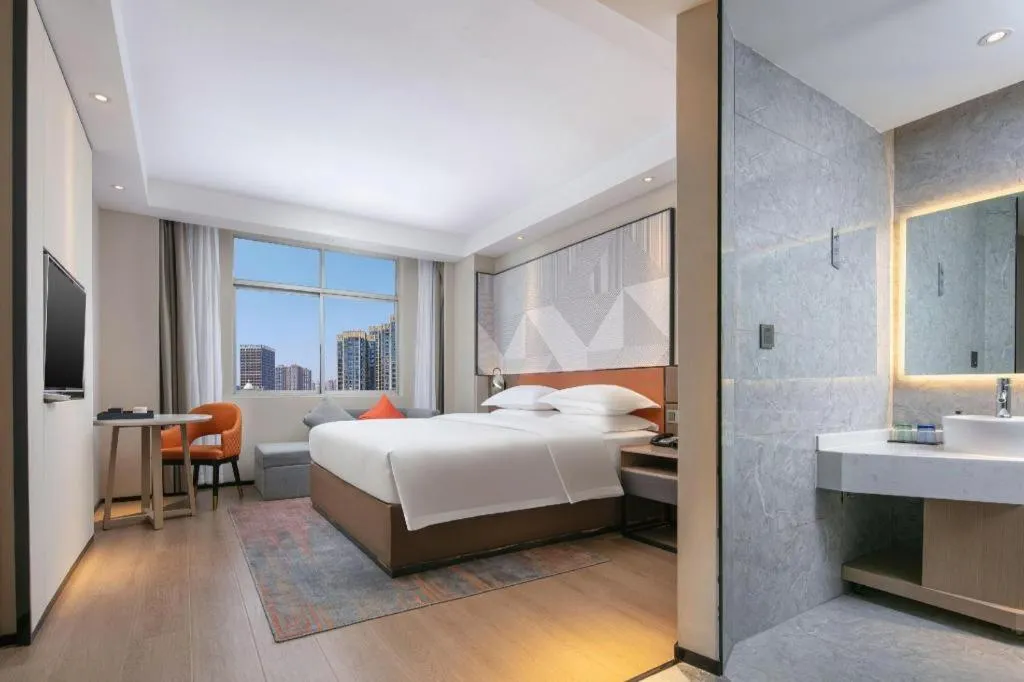 Bed in Borrman Hotel Qianjiang High-speed Railway Station Lobster City