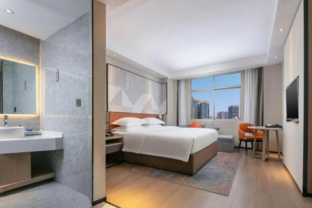 Bed in Borrman Hotel Qianjiang High-speed Railway Station Lobster City