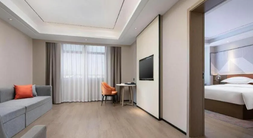 Bed in Borrman Hotel Qianjiang High-speed Railway Station Lobster City