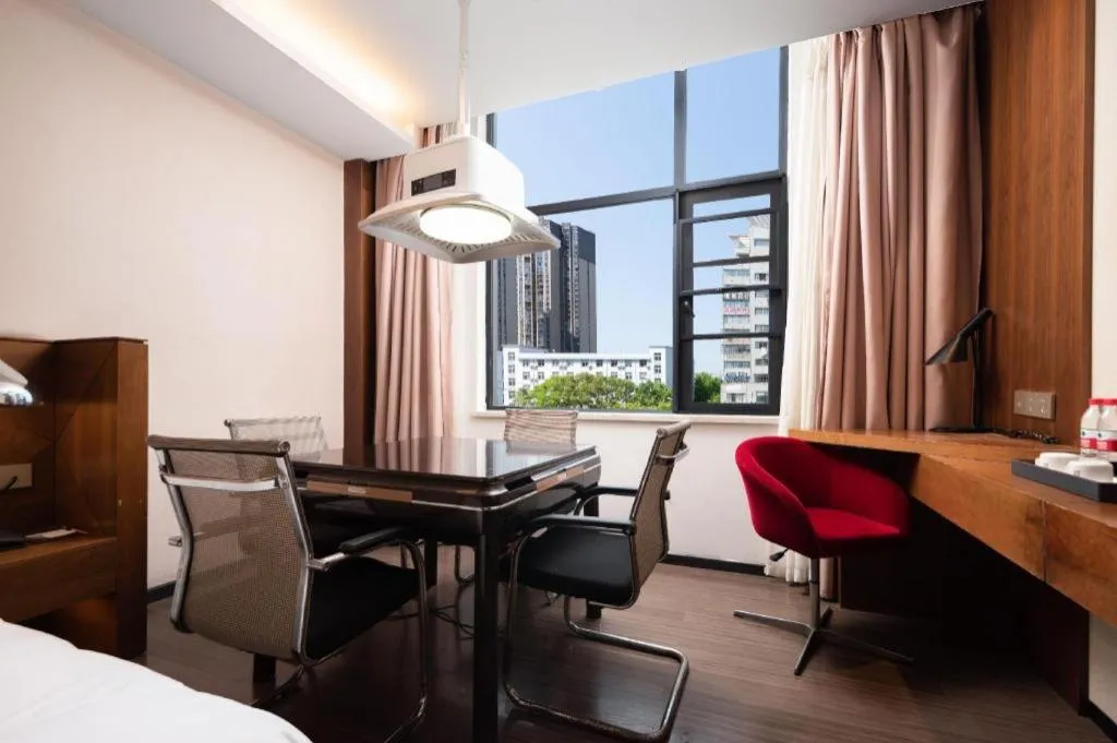 Bed in Borrman Hotel Qianjiang High-speed Railway Station Lobster City