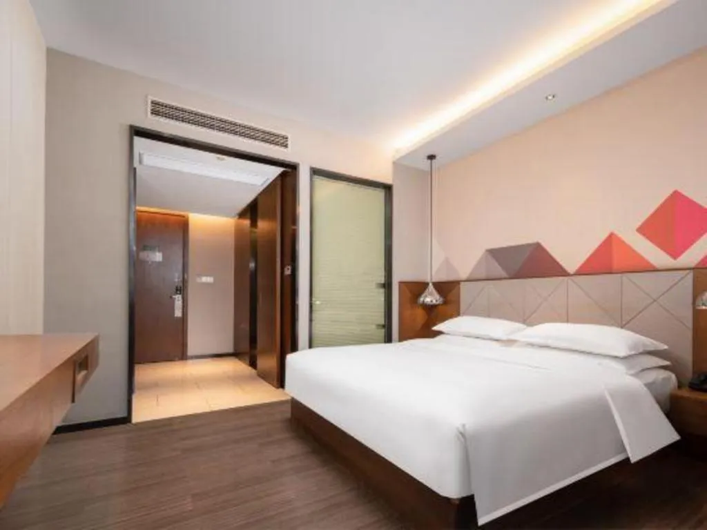 Bed in Borrman Hotel Qianjiang High-speed Railway Station Lobster City