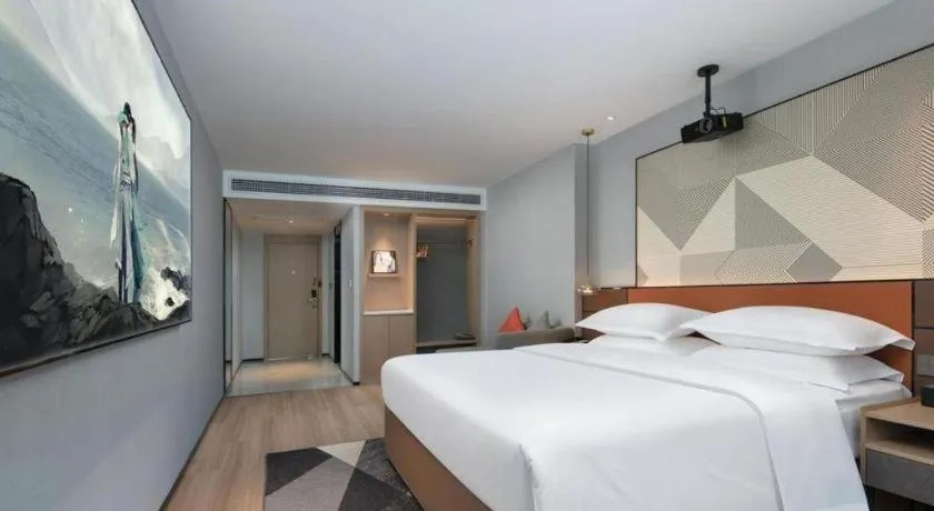 Bed in Borrman Hotel Qianjiang High-speed Railway Station Lobster City