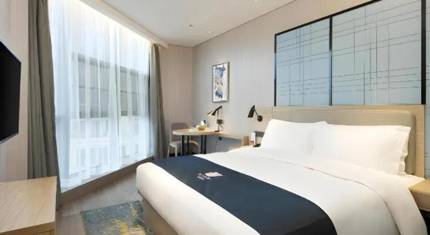 Bed in Echarm Hotel Changsha Gaoqiao