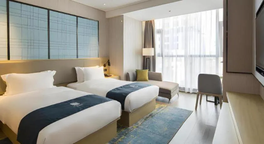 Bed in Echarm Hotel Changsha Gaoqiao
