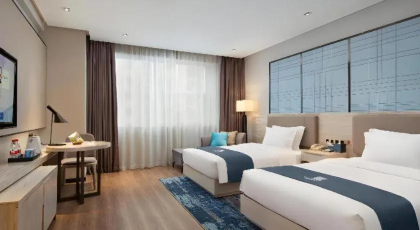 Bed in Echarm Hotel Changsha Gaoqiao