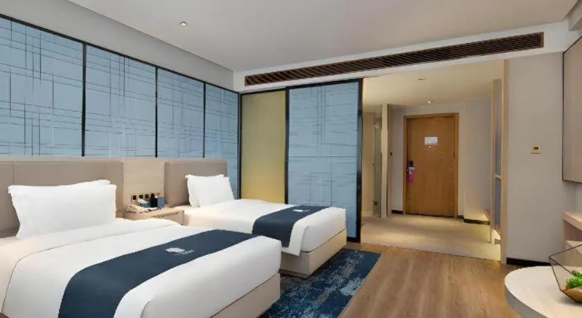 Bed in Echarm Hotel Changsha Gaoqiao
