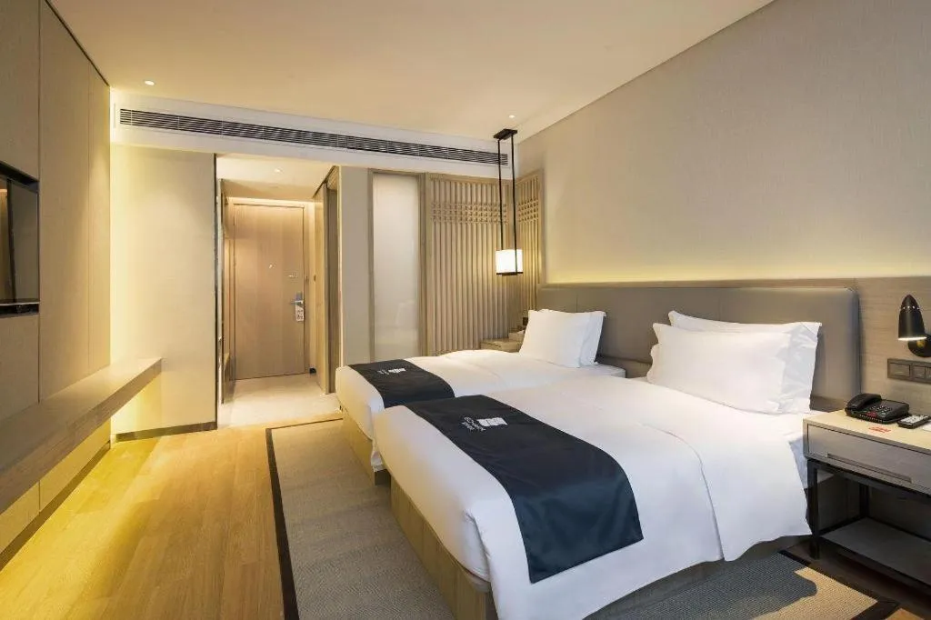 Bed in Echarm Hotel Changsha Gaoqiao
