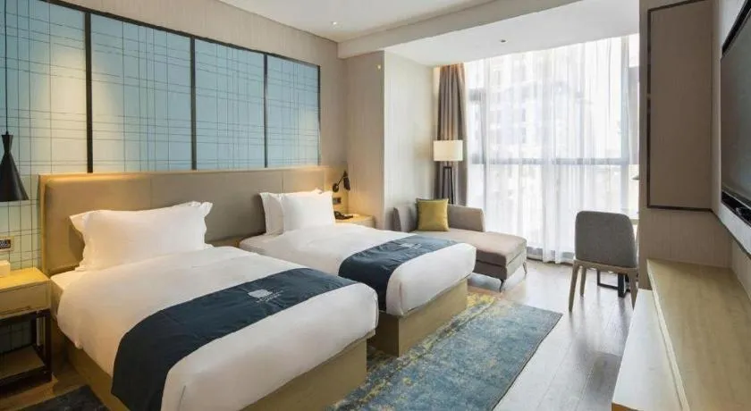 Bed in Echarm Hotel Changsha Gaoqiao