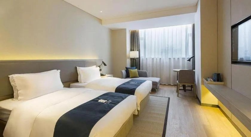 Bed in Echarm Hotel Changsha Gaoqiao