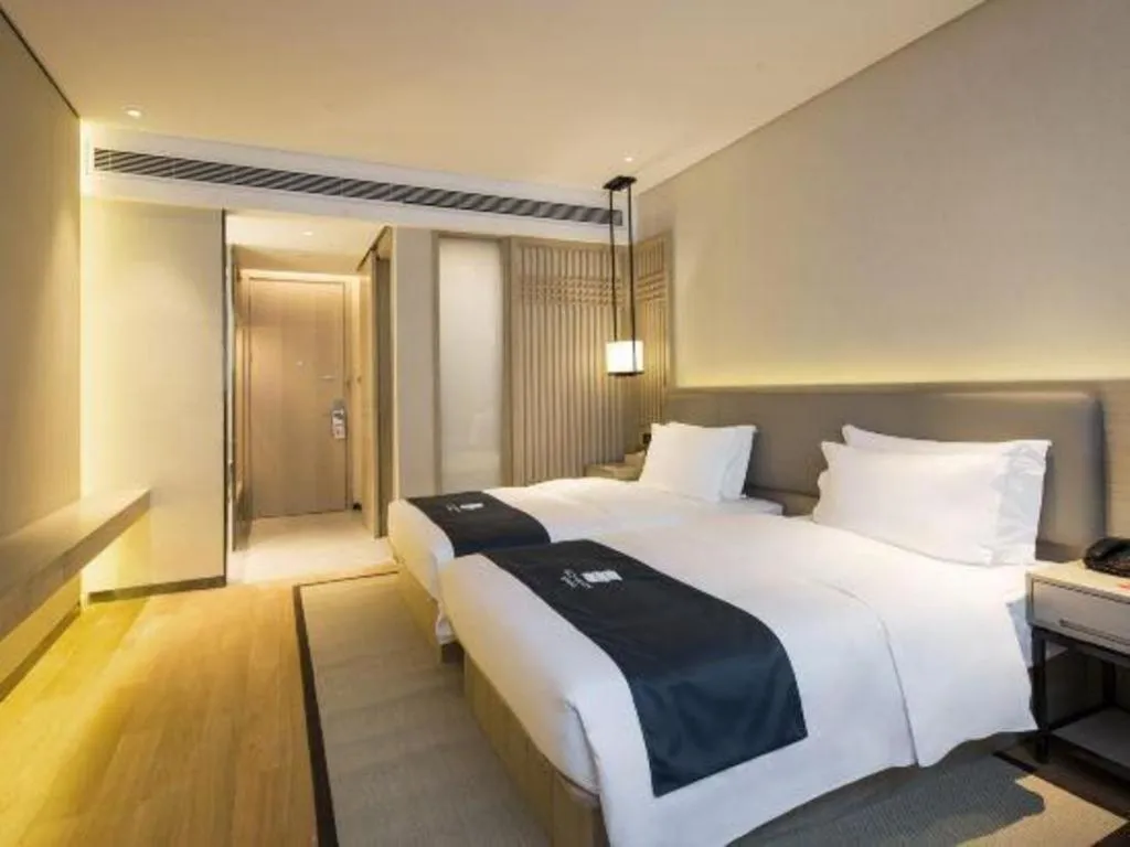 Bed in Echarm Hotel Changsha Gaoqiao