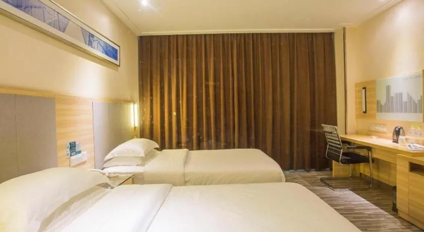 Bed in City Comfort Inn Fangcheng Qunxing Avenue