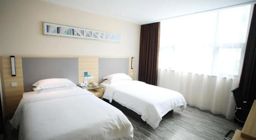 Bed in City Comfort Inn Fangcheng Qunxing Avenue