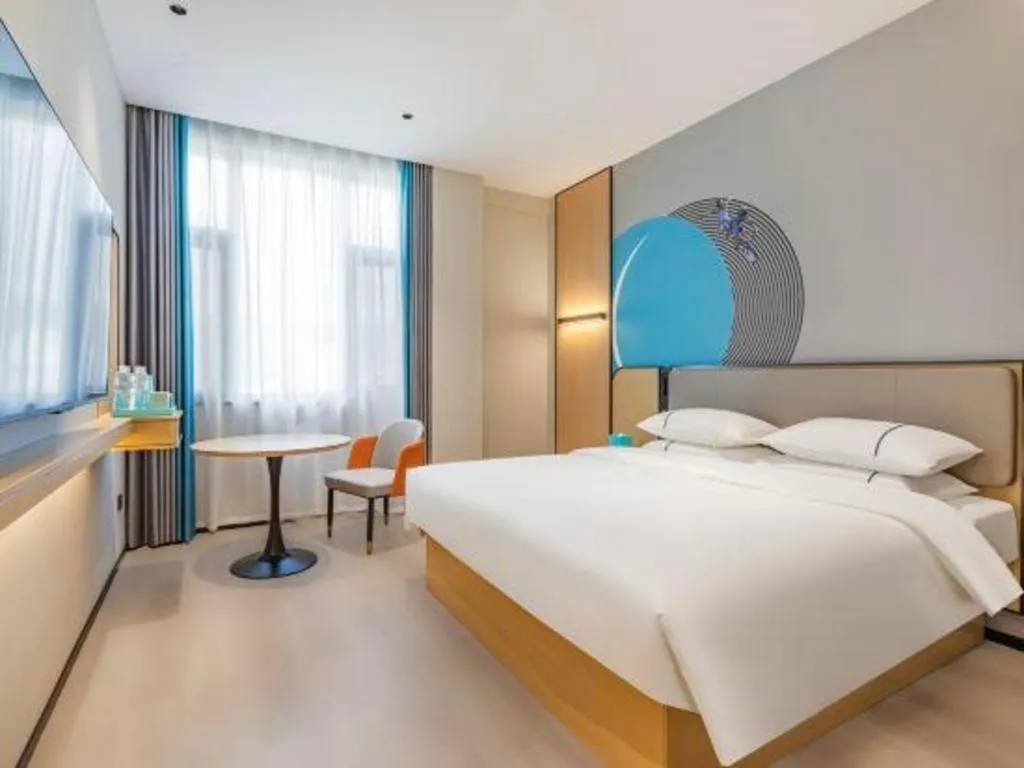 Bed in City Comfort Inn Huanggang Tuanfeng Passenger