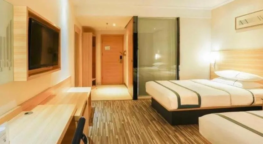 Bed in City Comfort Inn Deyang Shifang Yonghu Park