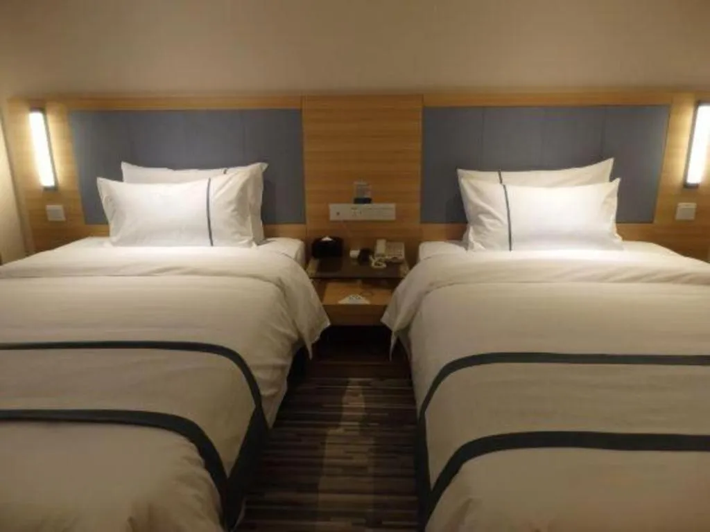 Bed in City Comfort Inn Deyang Shifang Yonghu Park