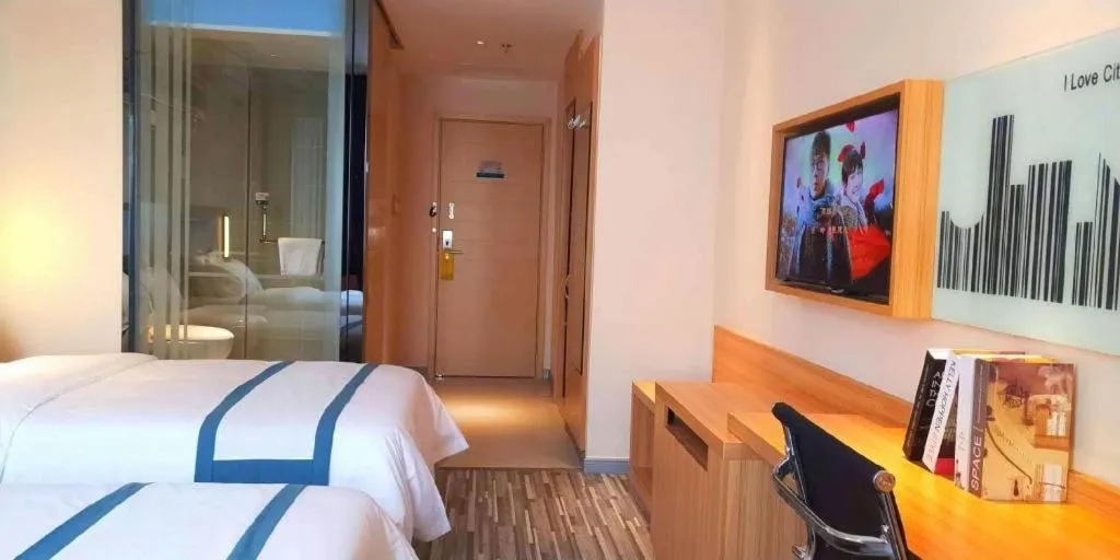 Bed in City Comfort Inn Deyang Shifang Yonghu Park