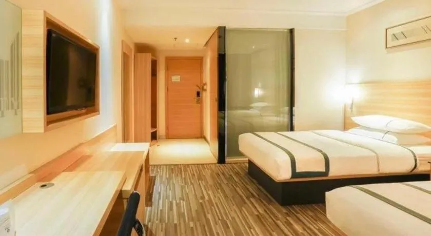 Bed in City Comfort Inn Deyang Shifang Yonghu Park