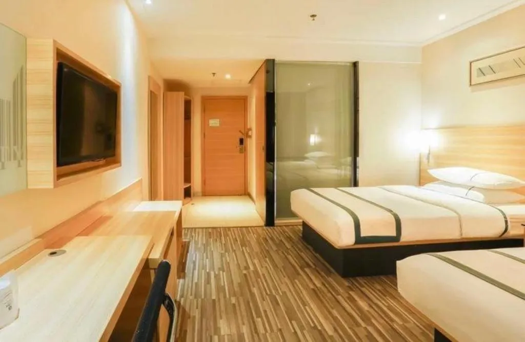 Bed in City Comfort Inn Deyang Shifang Yonghu Park