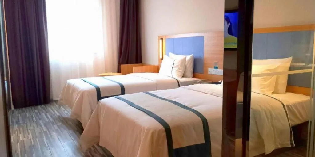 Bed in City Comfort Inn Deyang Shifang Yonghu Park