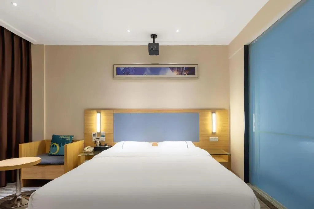 Bed in City Comfort Inn Deyang Shifang Yonghu Park