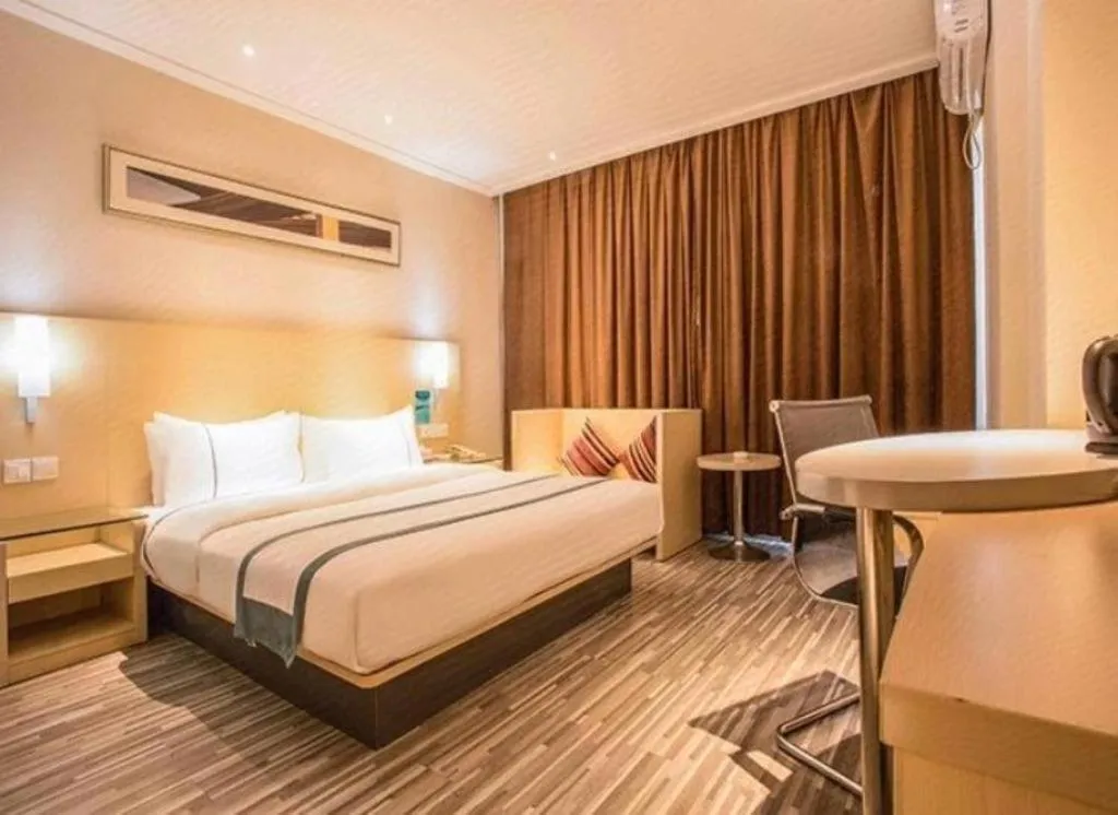 Bed in City Comfort Inn Deyang Shifang Yonghu Park