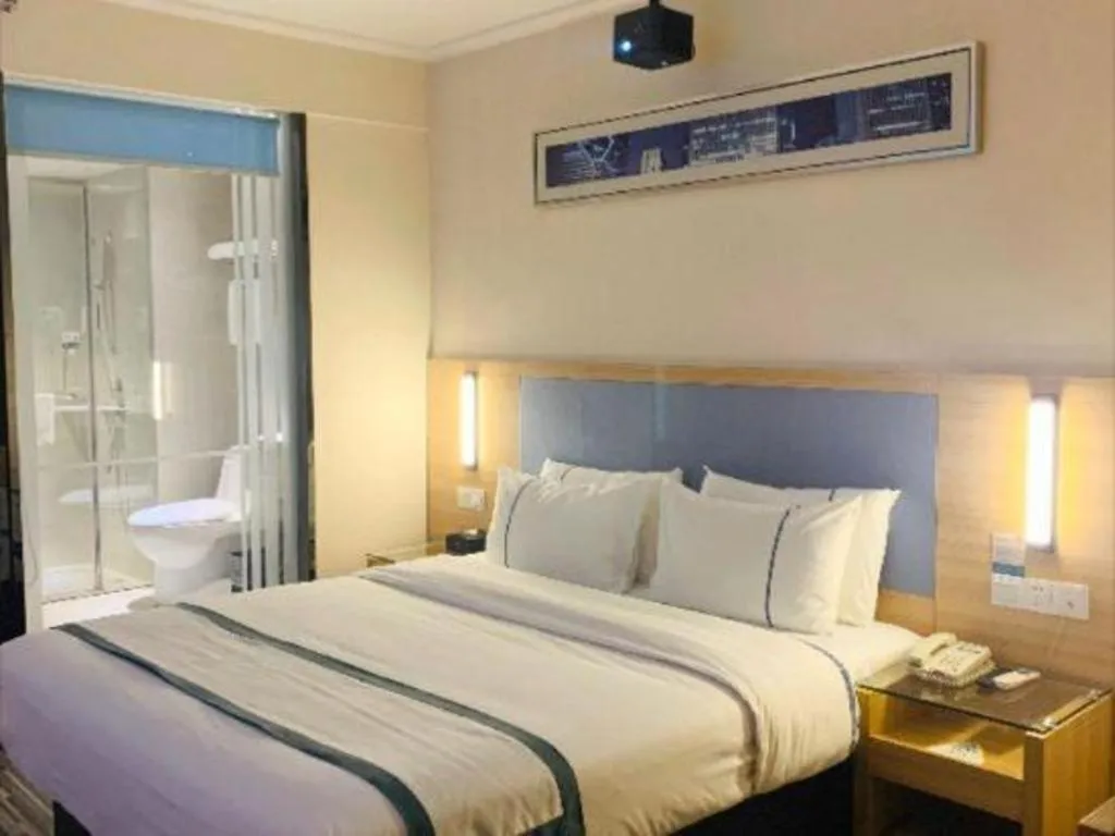 Bed in City Comfort Inn Deyang Shifang Yonghu Park