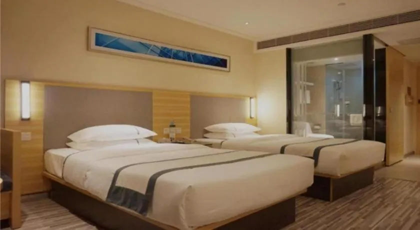 Bed in City Comfort Inn Deyang Shifang Yonghu Park