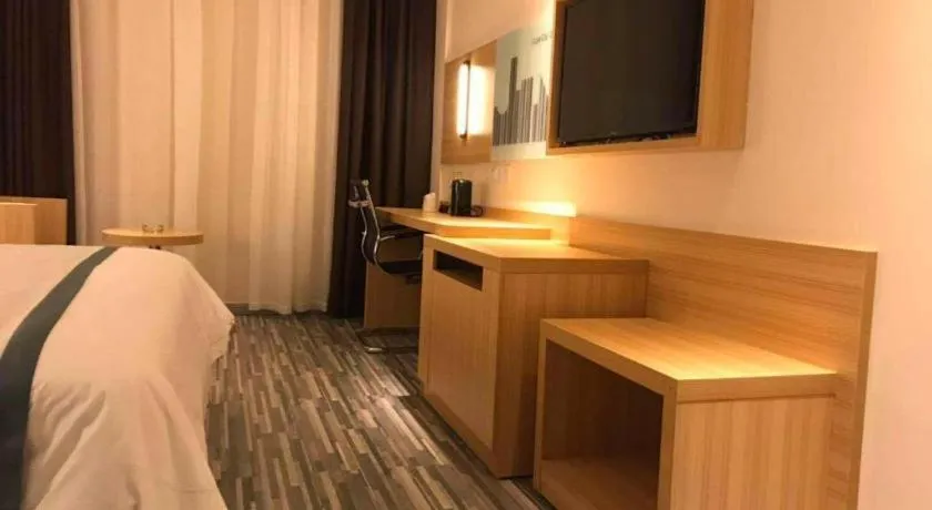 Bed in City Comfort Inn Deyang Shifang Yonghu Park