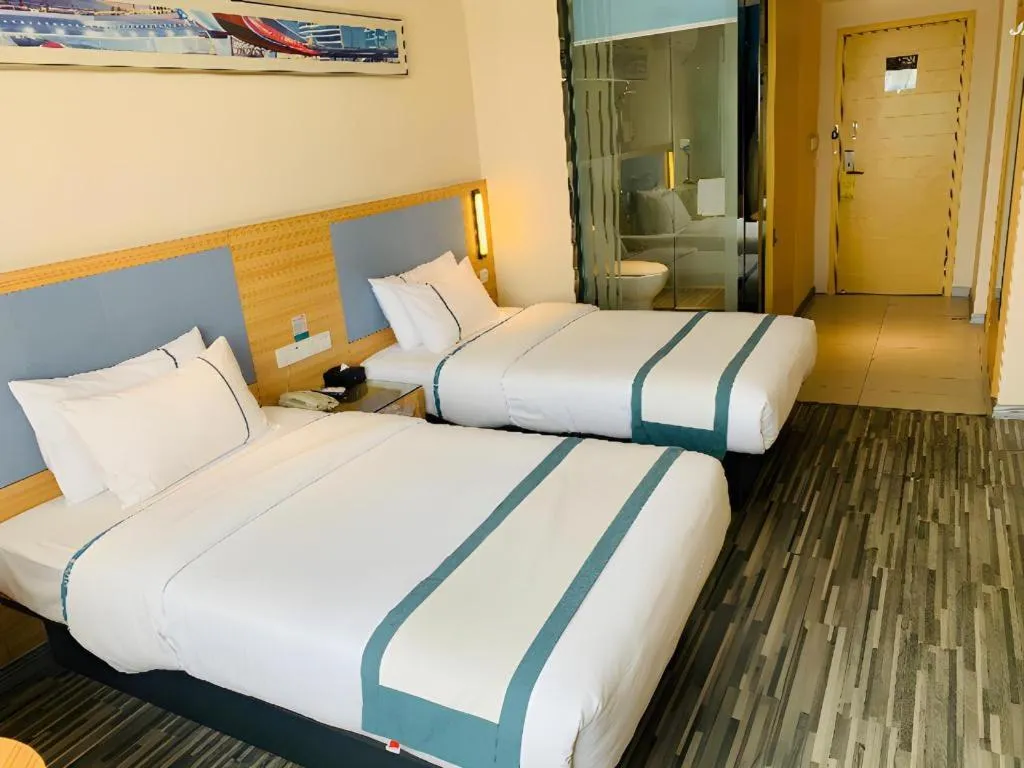 Bed in City Comfort Inn Deyang Shifang Yonghu Park