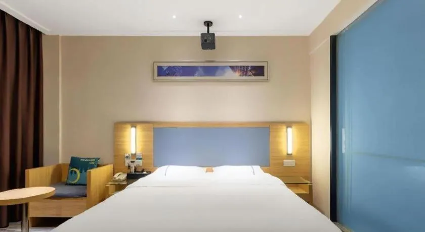 Bed in City Comfort Inn Deyang Shifang Yonghu Park
