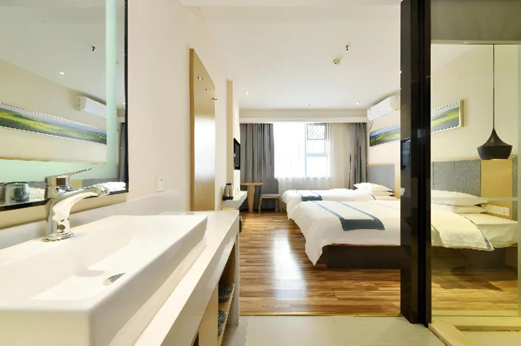 Bed in City Comfort Inn Wuhan Xinzhou Mo'er Cheng