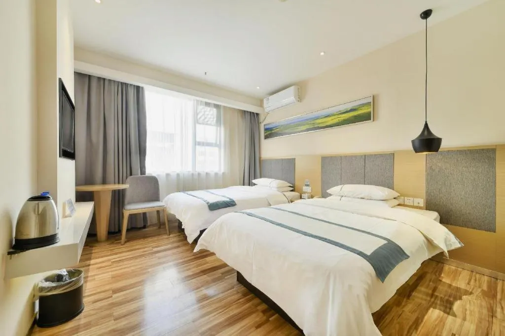 Bed in City Comfort Inn Wuhan Xinzhou Mo'er Cheng