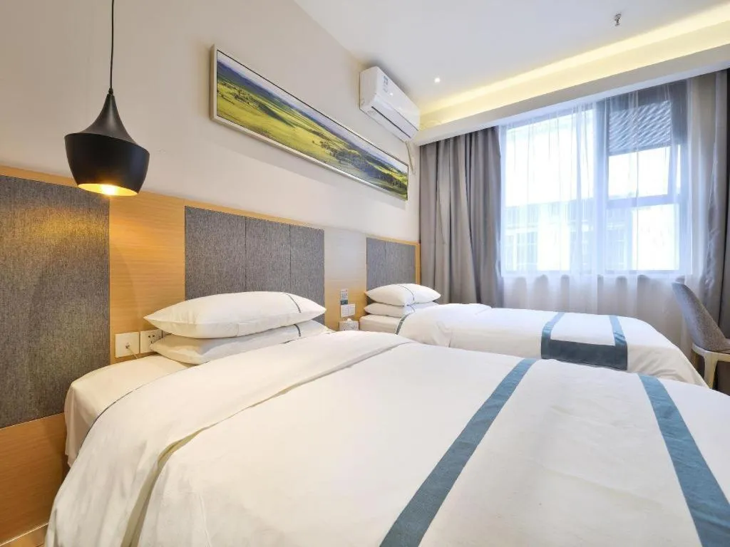 Bed in City Comfort Inn Wuhan Xinzhou Mo'er Cheng