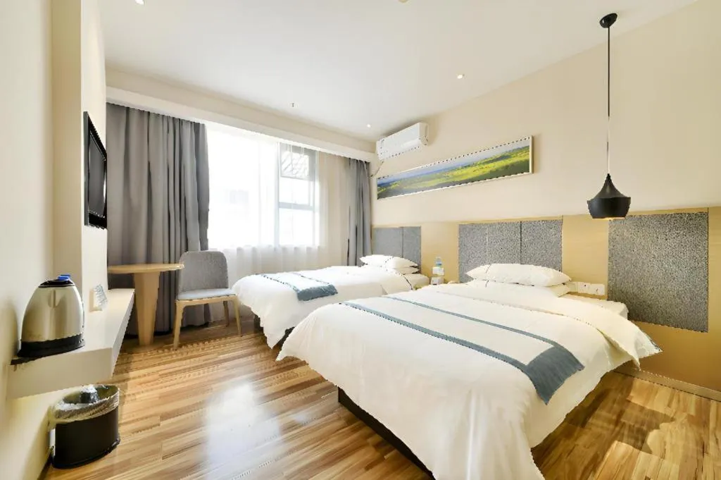 Bed in City Comfort Inn Wuhan Xinzhou Mo'er Cheng