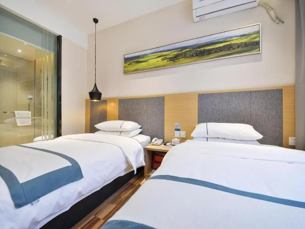 Bed in City Comfort Inn Wuhan Xinzhou Mo'er Cheng