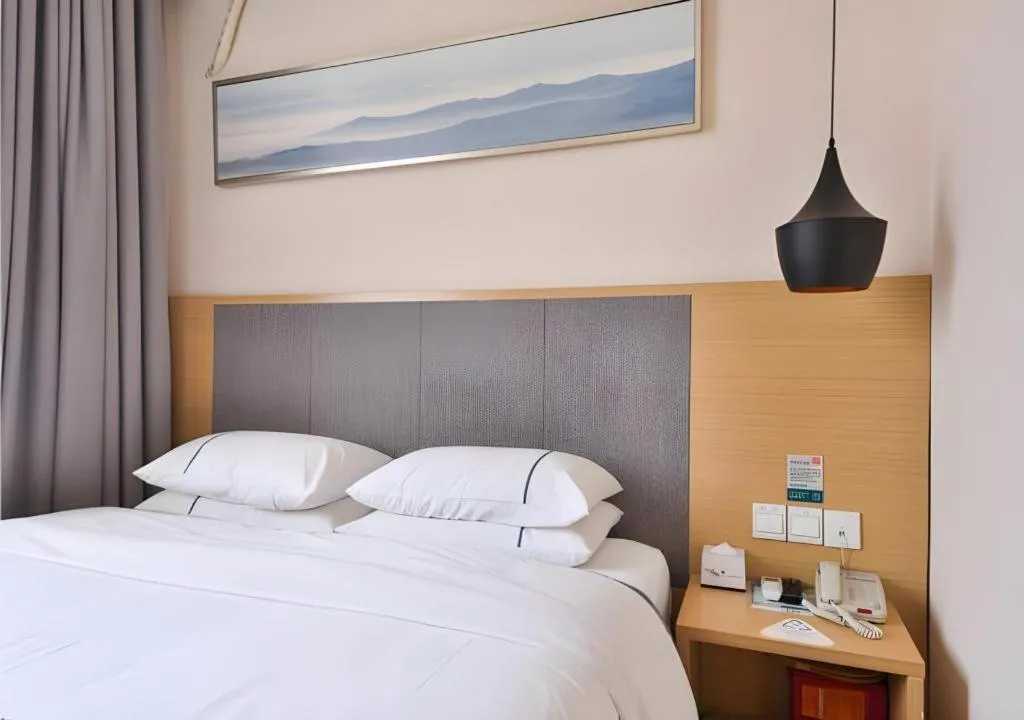 Bed in City Comfort Inn Wuhan Xinzhou Mo'er Cheng