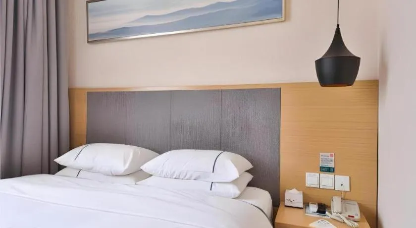 Bed in City Comfort Inn Wuhan Xinzhou Mo'er Cheng