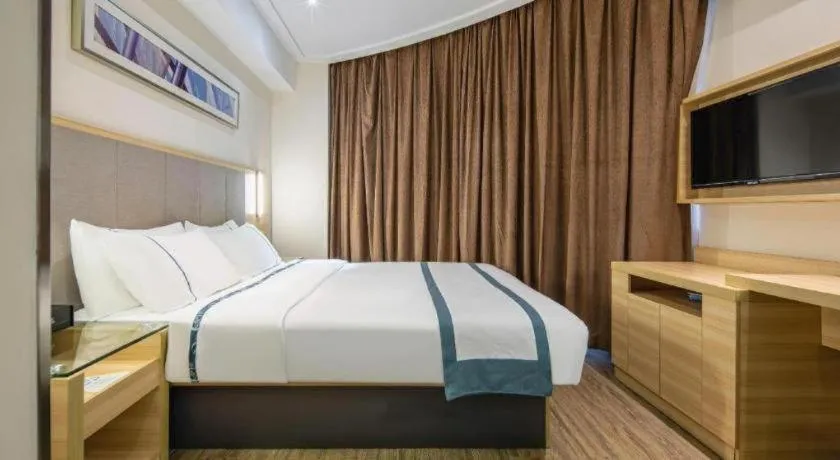 Bed in City Comfort Inn Wuzhou Arcade City Sanzongfu