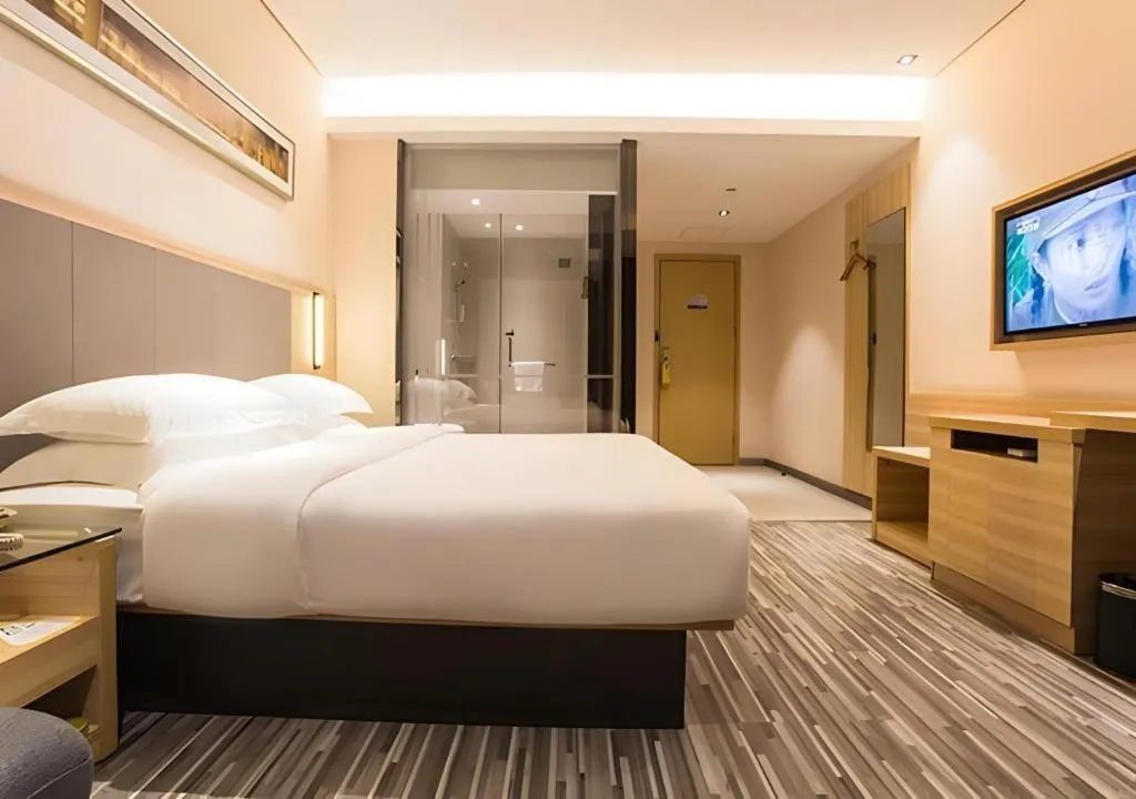 Bed in City Comfort Inn Wuzhou Arcade City Sanzongfu