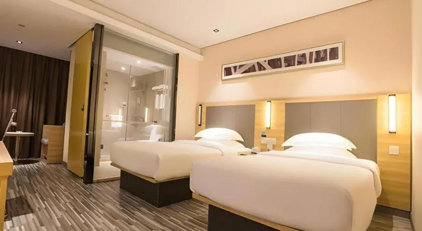 Bed in City Comfort Inn Wuzhou Arcade City Sanzongfu