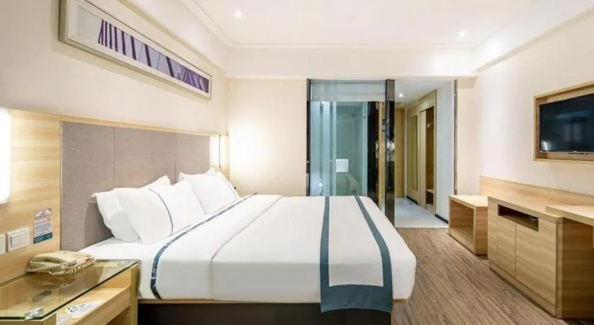 Bed in City Comfort Inn Wuzhou Arcade City Sanzongfu