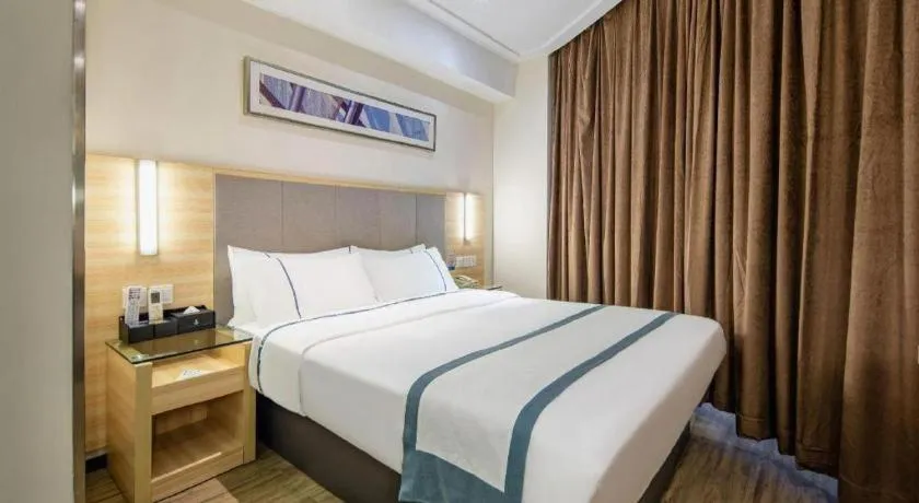 Bed in City Comfort Inn Wuzhou Arcade City Sanzongfu