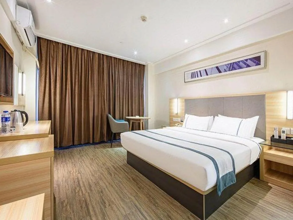Bed in City Comfort Inn Wuzhou Arcade City Sanzongfu