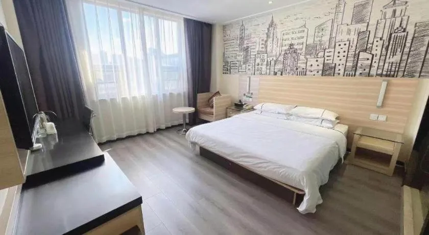 Bed in City Comfort Inn Huanggang Dongmen Road Wanda Plaza