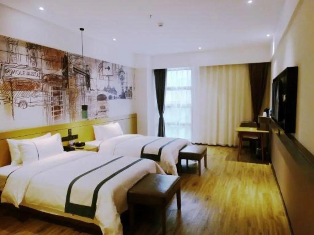 Bed in City Comfort Inn Meishan Wanda Plaza