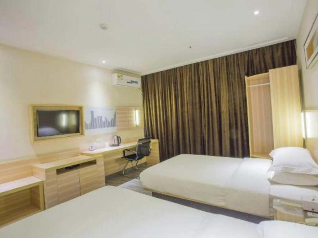Bed in City Comfort Inn Hechi Bama Shouxiang Avenue