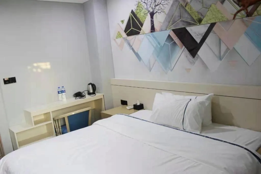 Bed in City Comfort Inn Shaoguan High-speed Railway Station Xilian Examination Center