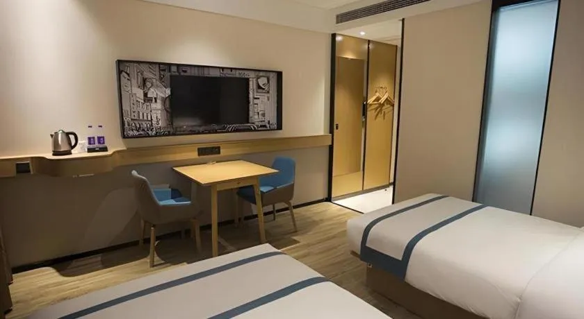 Bed in City Comfort Inn Taizhou Wanda Plaza