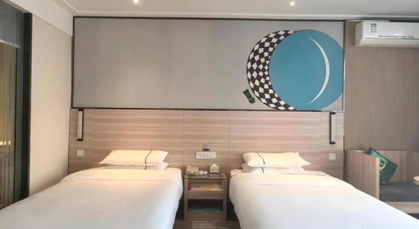 Bed in City Comfort Inn Huanggang Qichun Exhibition Center